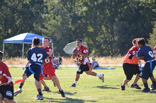 students playing football